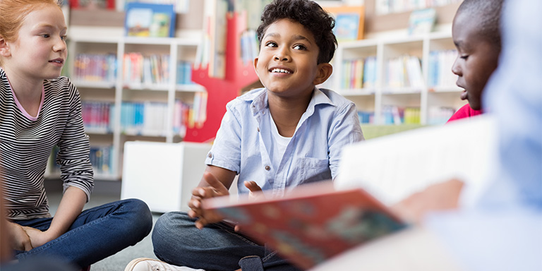 Boy with Asperger's / Autism Spectrum Disorder enjoying school classroom
