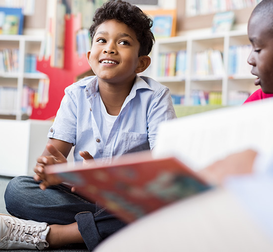 Boy with Asperger's / Autism Spectrum Disorder enjoying school classroom